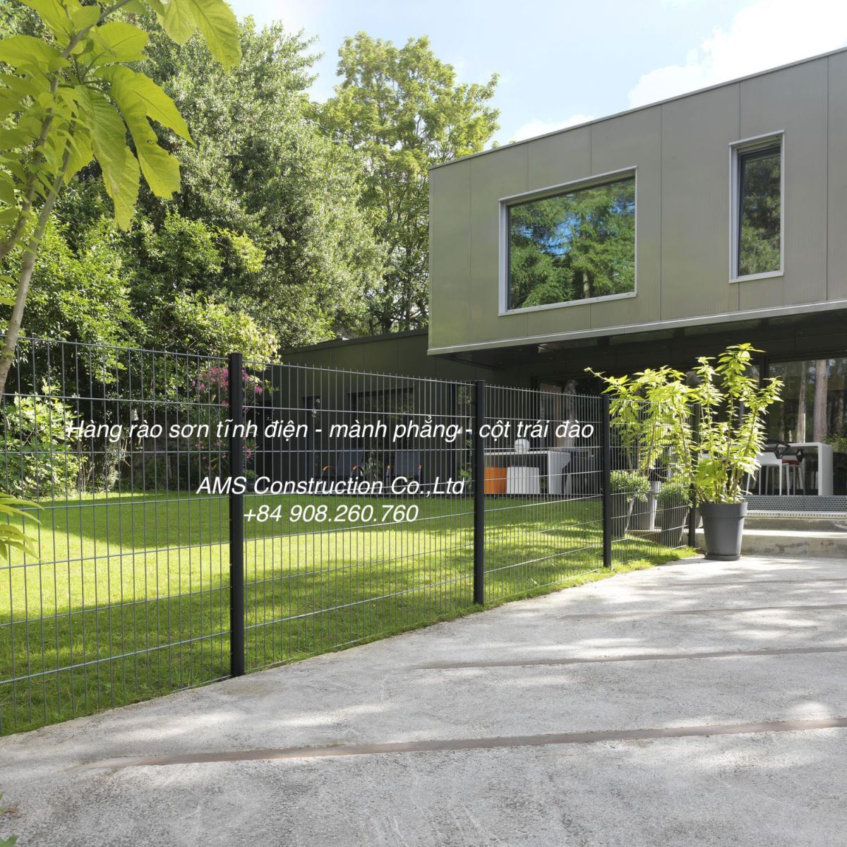 A black gate in front of a buildingDescription automatically generated with low confidence